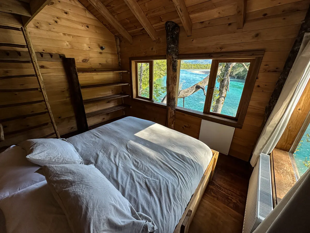 Coihue Room, king bed and windows over the river